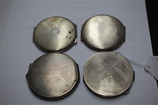 Two 1920s and two 1930s Art Deco engine turned silver and guilloche enamel circular compacts, 2.75in et infra.